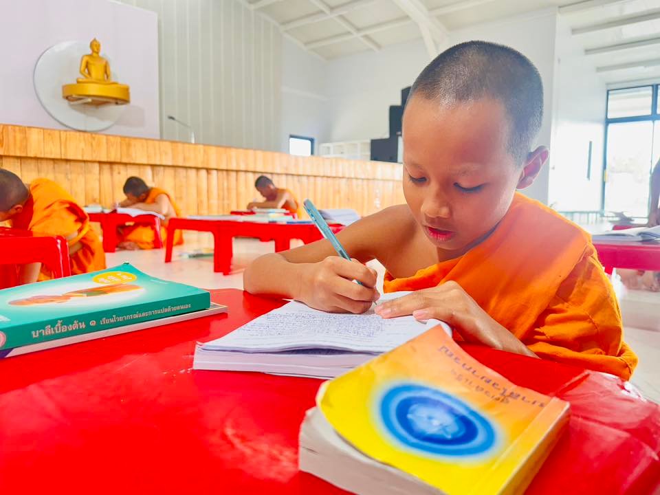 A group of people meditating in a tranquil hall